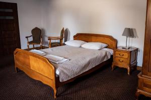 Posteľ alebo postele v izbe v ubytovaní Hotel Przy Dworze