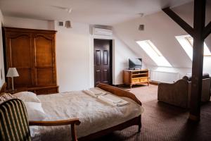 Posteľ alebo postele v izbe v ubytovaní Hotel Przy Dworze
