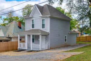 a gray house with a white porch at Charming Roanoke Vacation Home - 1 Mi to Downtown! in Roanoke