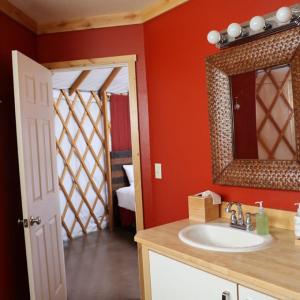 a bathroom with a sink and a mirror at Sagecliffe Resort & Spa in George