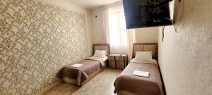 TV a/nebo společenská místnost v ubytování RUBENYAN GUEST HOUSE
