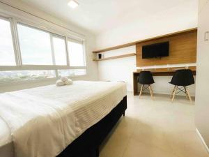 Postel nebo postele na pokoji v ubytování Apto Estilo ao lado PUC + 19 fotografií