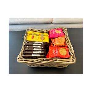 a basket full of candy on a shelf at The Maison- Cozy home stay in Nottingham