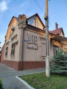 a building with a vip hotel sign on it at VIP Hotel in Izmail
