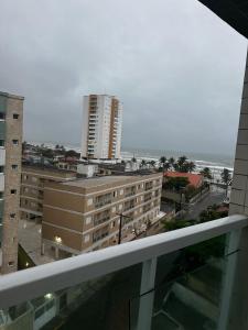 a view of a city from a balcony of a building at Apartamento Mongaguá in Mongaguá