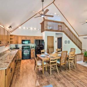 a kitchen with a table and chairs and a ceiling fan at Peaceful Pond family fun getaway in Albrightsville