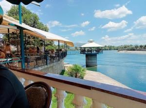a restaurant with a view of the water at Villa Castle View in Shkodër