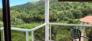 a room with a view of a mountain at Weston in Deshaies