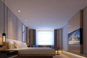 Ένα ή περισσότερα κρεβάτια σε δωμάτιο στο Fairfield by Marriott Harbin Downtown