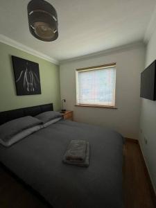 a bedroom with a bed and a window at Apt 1 prime central Location close cathedral in Norwich