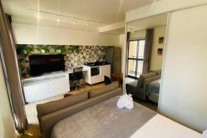 Ένα ή περισσότερα κρεβάτια σε δωμάτιο στο Apartamento encantador no Bairro da Liberdade