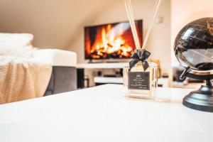 Ένα ή περισσότερα κρεβάτια σε δωμάτιο στο Les temps heureux