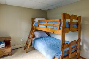 two bunk beds in a room with a bed at Centrally Located New Jersey Home with Private Yard in Lambertville