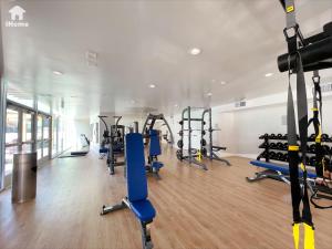 a gym with several tread machines in a room at Perfect Apt w Parking Gym Pool WIFI in Arts District DTLA near Little Tokyo B4 in Los Angeles