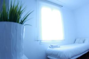 Кровать или кровати в номере Zubia Urban Rooms