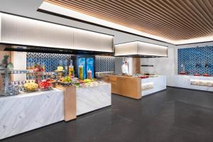 a kitchen with a counter with food on it at Fairfield by Marriott Kunming Xinying in Kunming