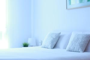 Кровать или кровати в номере Zubia Urban Rooms