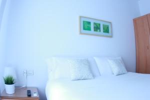 Кровать или кровати в номере Zubia Urban Rooms
