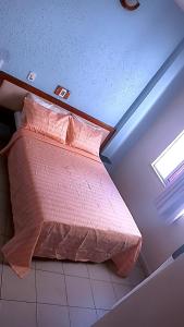 מיטה או מיטות בחדר ב-Hotel Fenix Salvador