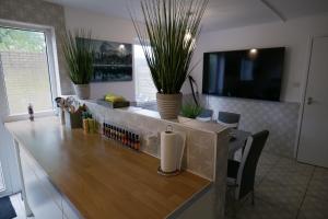 a kitchen with a counter with plants on it at Giomakay luxury Rooms Milton Keynes in Milton Keynes