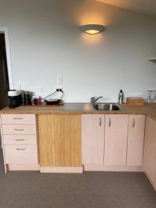 a kitchen with a sink and a counter top at Kaingarua Retreat in Kerikeri