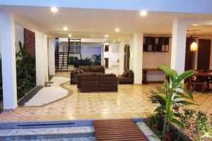 a living room with a couch and a table at Casa Amarilla in Honda