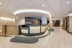 a lobby with a bar in a building at Best Western Premier Park Hotel in Madison