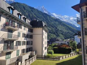 a view of the mountains from a building at 4-star apartments in Chamonix centre with free private parking in Chamonix-Mont-Blanc