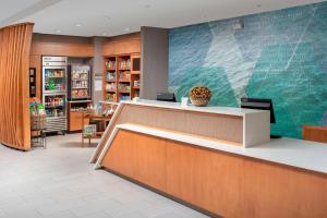 a lobby of a library with a reception desk at SpringHill Suites by Marriott Punta Gorda Harborside in Punta Gorda