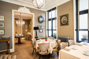 a dining room with a table and chairs at Hotel Vendome - BW Signature Collection in Vendôme