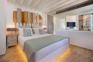 A bed or beds in a room at Lindos Allure Villa with Jacuzzi and Acropolis view!!!