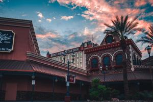 a building with a palm tree in front of it at Boulder Station Hotel & Casino in Las Vegas