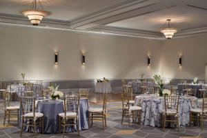 a ballroom with tables and chairs and a room filled with tables and chairsktop at Renaissance Providence Downtown Hotel in Providence