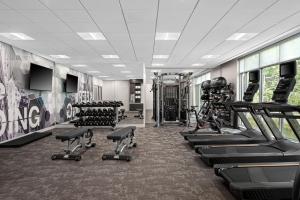 a gym with treadmills and machines in a room at SpringHill Suites by Marriott Kalamazoo Portage in Portage
