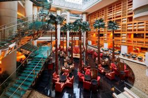 a view of the lobby of a hotel with palm trees at The Westin Bund Center, Shanghai in Shanghai