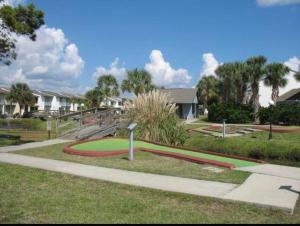a park with a green and red circle in the grass at Wanderlust Villa only 3 min walk to the Sand! in Panama City Beach