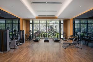 a gym with several treadmills and exercise bikes at Fairfield by Marriott Taizhou Bay in Taizhou