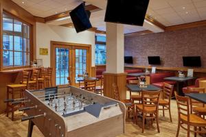 a restaurant with a chessboard in the middle of a room at Leipzig Marriott Hotel in Leipzig