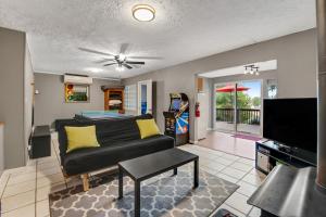 a living room with a couch and a tv at Liberty Port in Jefferson City