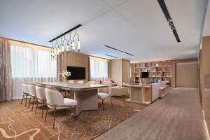 a large dining room with a table and chairs at Renaissance Shenzhen Luohu Hotel in Shenzhen