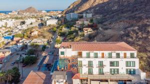 an aerial view of a town with a mountain at Morgan Apart-Hotel & Residences in Cabo San Lucas +16 photos