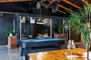 a pool table in the middle of a room at The Black Barn in Auckland