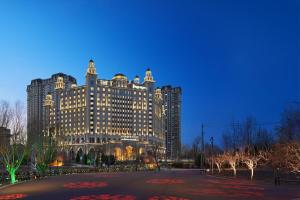 a large building is lit up at night at Sheraton Yinchuan in Yinchuan