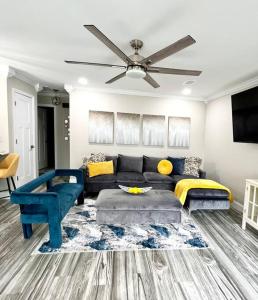 a living room with a couch and a ceiling fan at *The Gem* Stylish 2 Bedroom 1 Bathroom Newly Renovated in Ladson