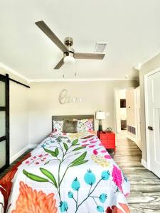 a bedroom with a bed with a love sign on the wall at *The Gem* Stylish 2 Bedroom 1 Bathroom Newly Renovated in Ladson