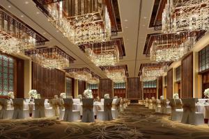 a banquet hall with tables and chairs and chandeliers at Wutai Mountain Marriott Hotel in Wutai