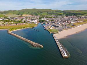 an aerial view of a beach next to a city at Ballypride in Girvan