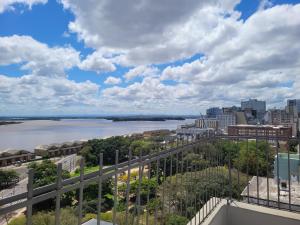 a view of a river and a city at Vista para o Guaíba in Porto Alegre