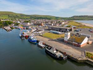 an aerial view of boats docked in a harbor at Kittys Cottage in Girvan