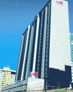 a large building in a city with tall buildings at 511. Flat Hotel S4 in Brasilia